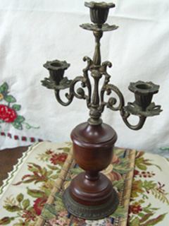 In the movie... antique bronze  candle holder  (USA)